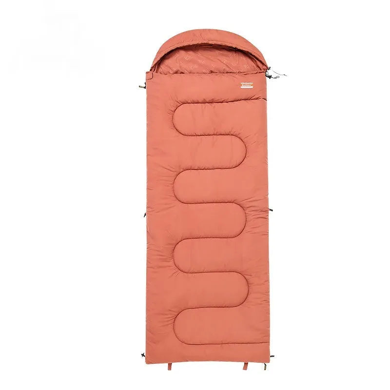 Ultra-light cotton camping sleeping bag quilt shown in ochre colour, folded to show quilted stitching.