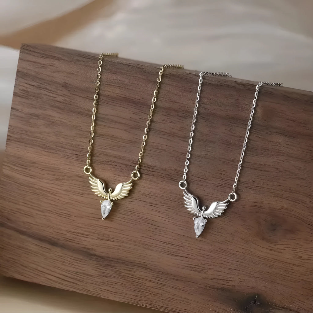 A silver necklace with an eagle pendant on an adjustable O-ring chain, available in white gold or yellow gold colour finish.