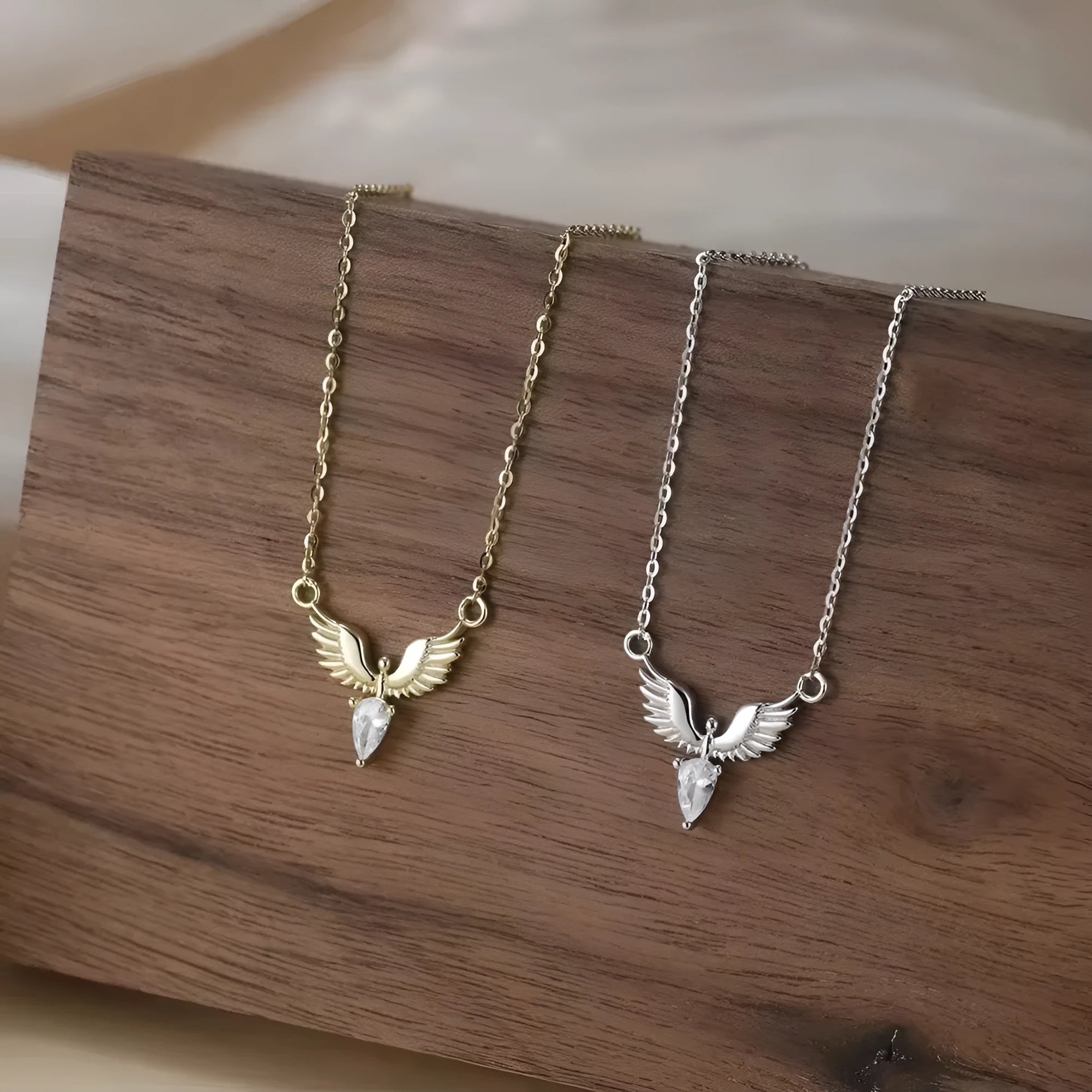 A silver necklace with an eagle pendant on an adjustable O-ring chain, available in white gold or yellow gold colour finish.