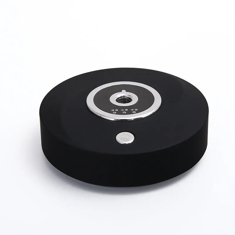 USB car air freshener spray diffuser in black plastic with anti-slip pad