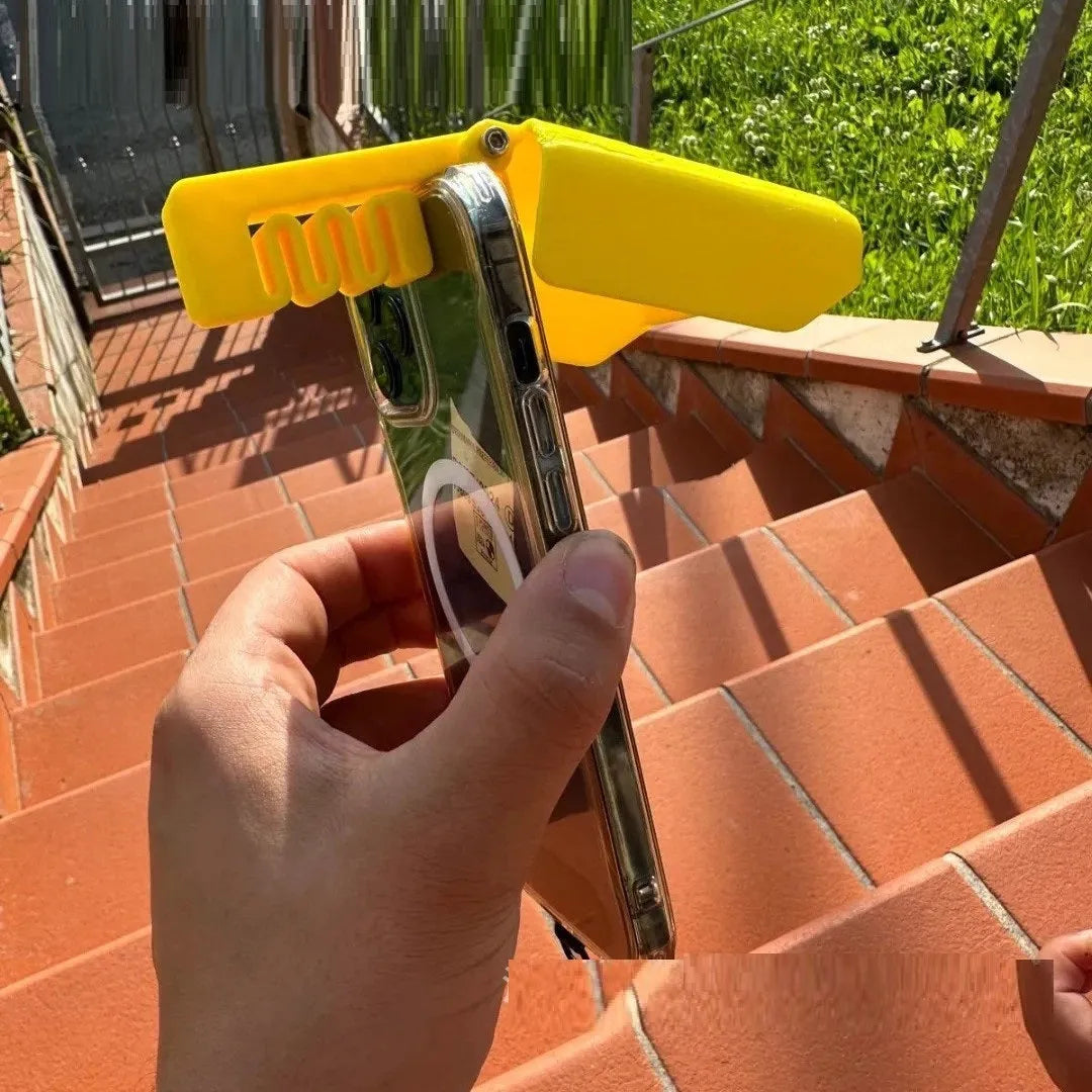 Yellow and black plastic phone sunshade with a clip for attachment to smartphones outdoors.