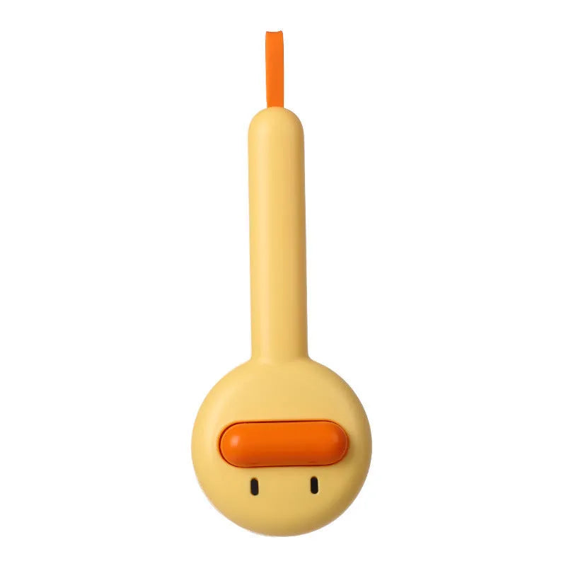 Small yellow duck-shaped pet grooming comb with needle pins for cats and dogs