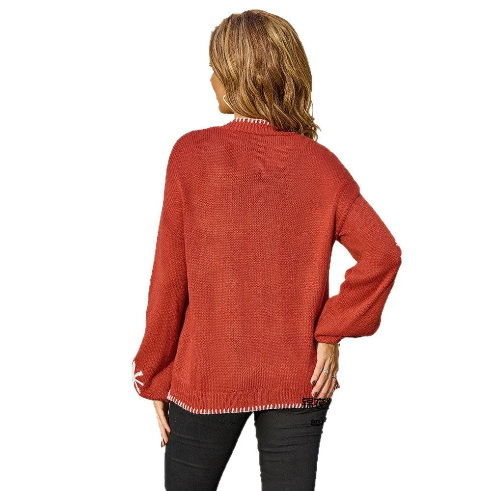 Plus size women's jacquard knitted coat with floral pattern in beige or orange colours, showing off-neck design and loose fit