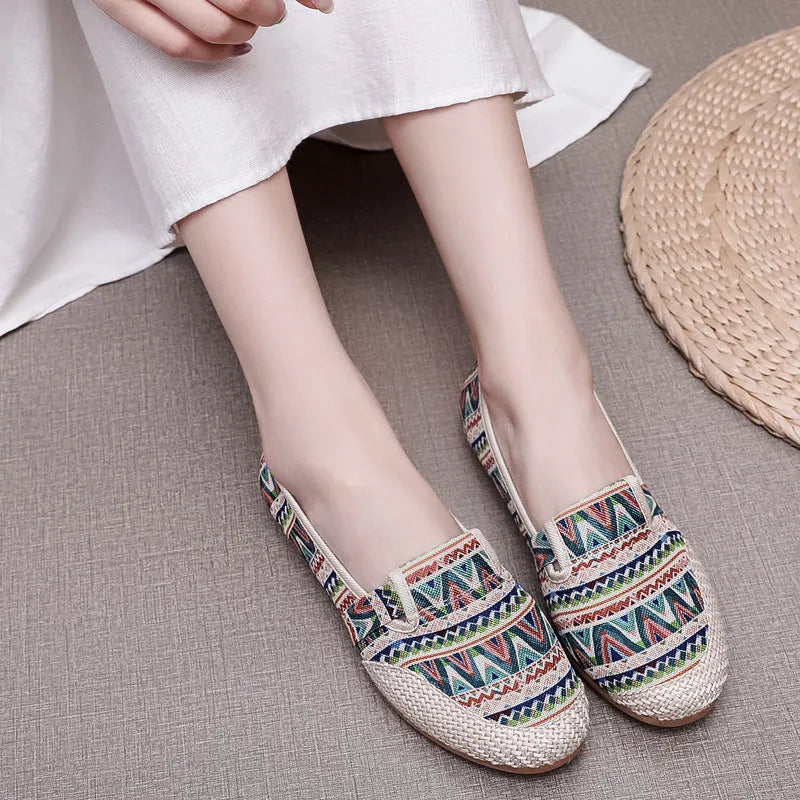 Women's flat heel cloth shoes in ethnic style with colour stitching and a shallow mouth design.