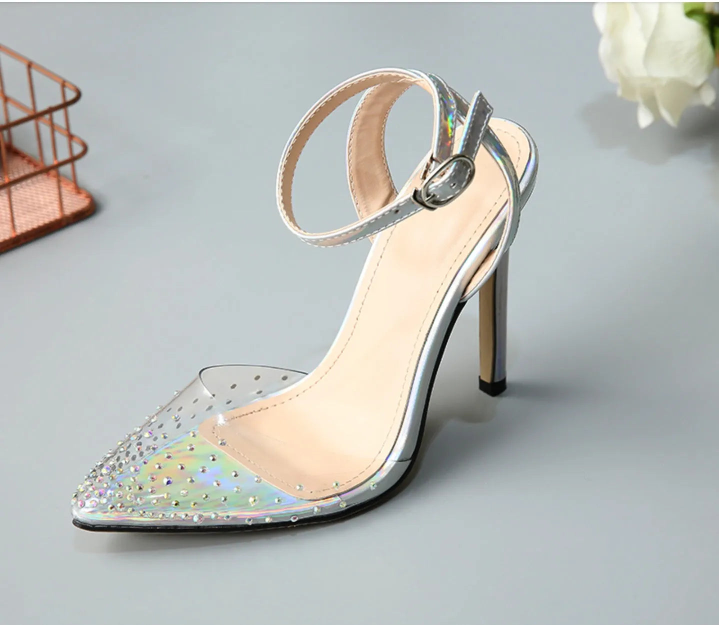Women's pointed-toe stiletto sandals with a diamond detail on the PVC upper.