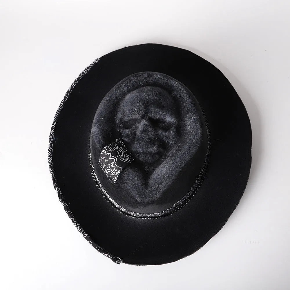 Handmade wool felt skull hat with a conical crown shape on a mannequin head.