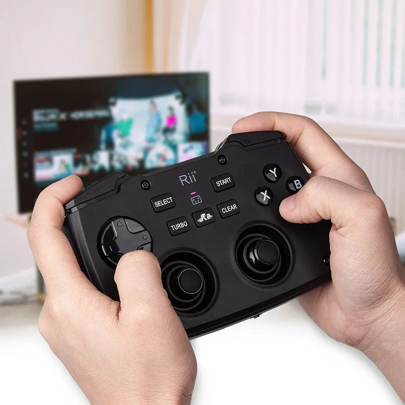 Wireless mini keyboard in black with USB receiver, compact ergonomic design for desktop use.