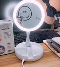 White acrylic LED vanity mirror with double-sided storage compartments and USB charging port