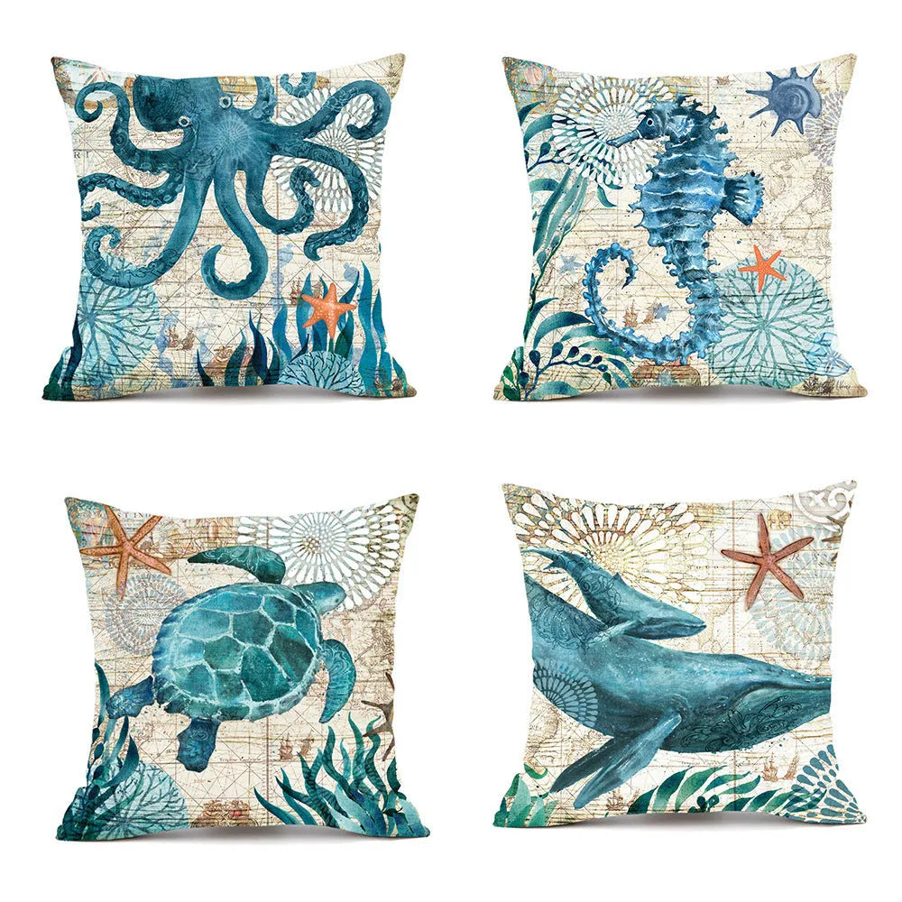 Square linen cushion cover with a detailed blue and green sea turtle print, shown on a grey sofa.