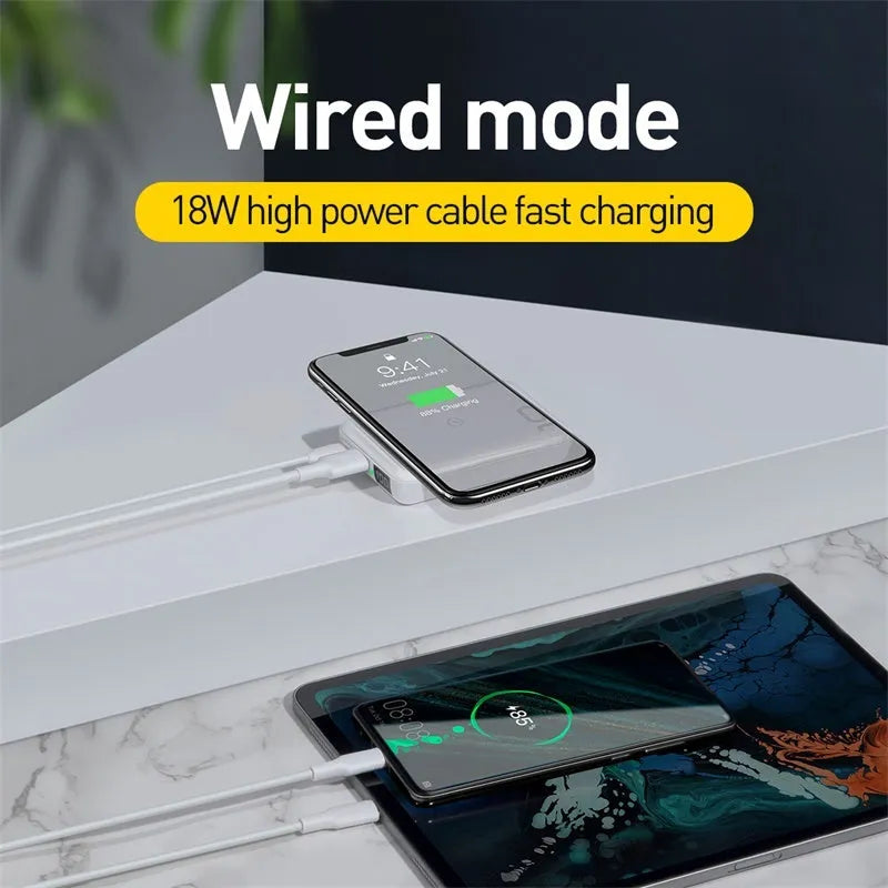 Small square black wireless fast charging power bank with digital display showing battery percentage