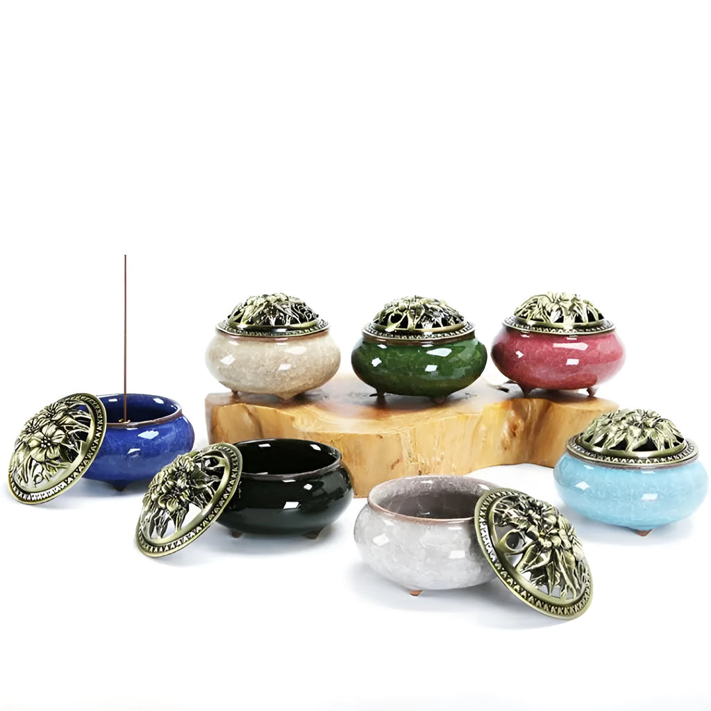 Ceramic incense burner in choice of twelve colours, shown next to incense sticks.