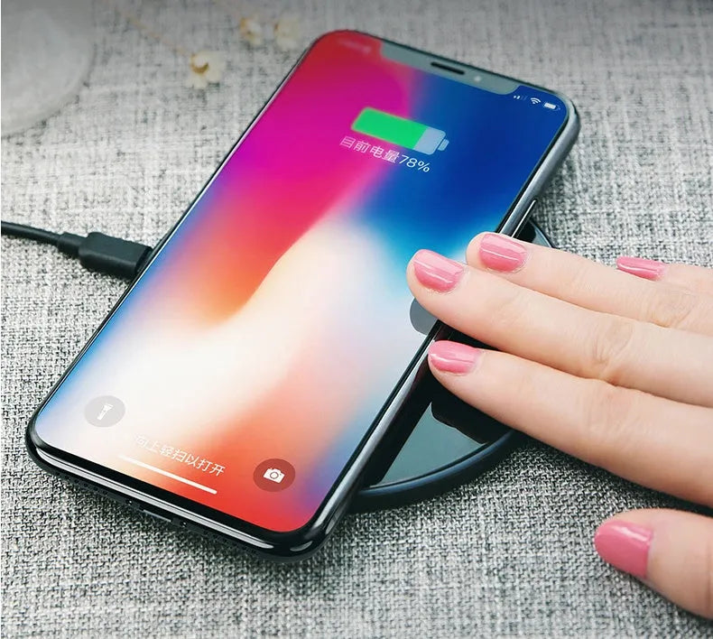 Glass disc wireless charger for smartphones in black or white with charging indicator