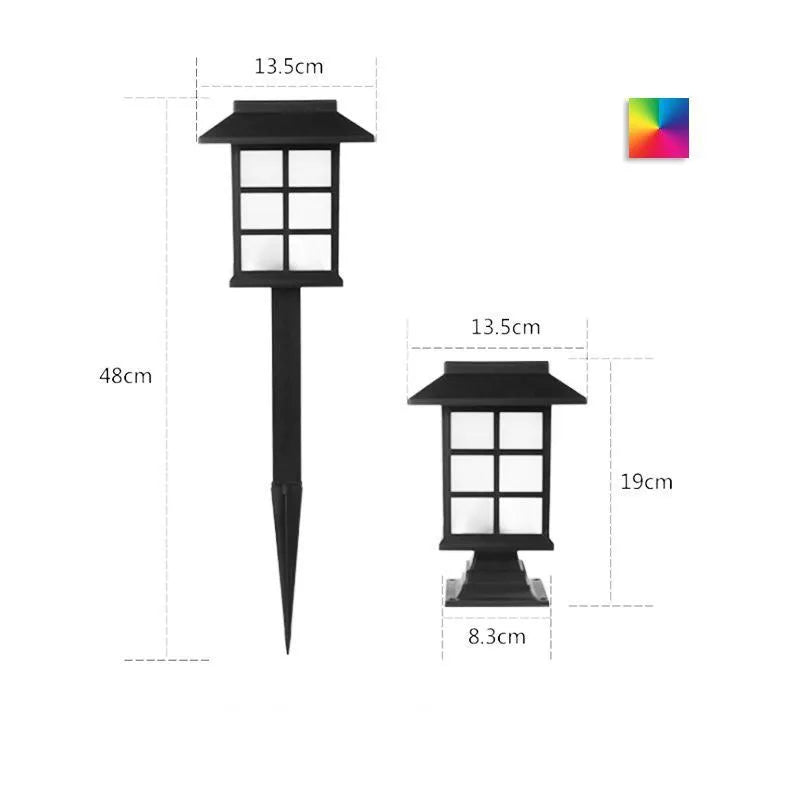 Black solar outdoor LED lawn light with window-style apertures emitting soft white or warm white light