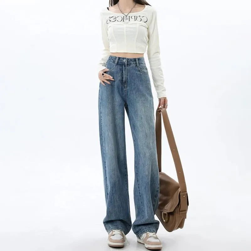 Women's retro blue high waist wide leg jeans on a hanger, showing straight cut and front button detail.