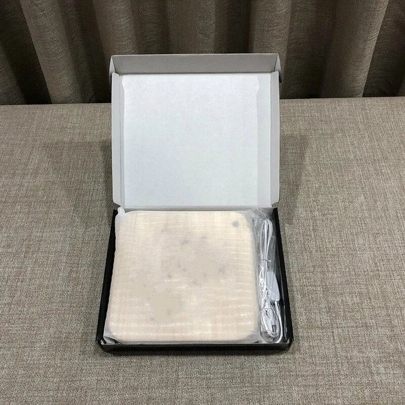 Square pine wood frame USB LED atmosphere lamp emitting warm white light on a desk.