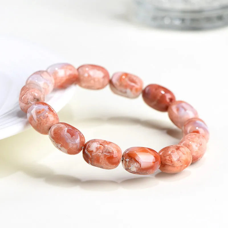 Original design agate bracelet with cherry blossom colour barrel beads and Ruyi charm.