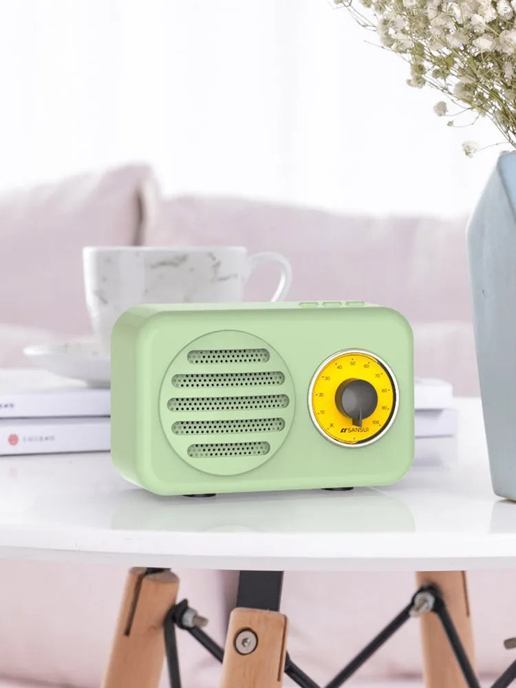 Portable Bluetooth speaker in wood grain finish with FM radio and micro USB cable