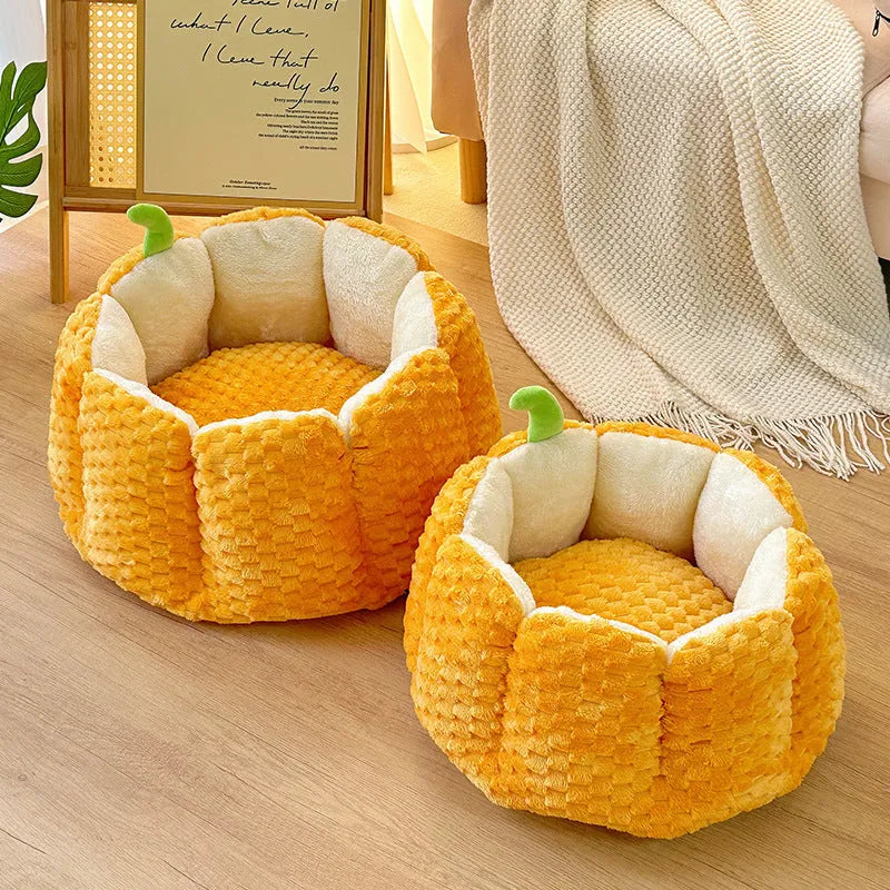 Pumpkin-shaped pet nest with raised sides and cotton filling for cats and small dogs