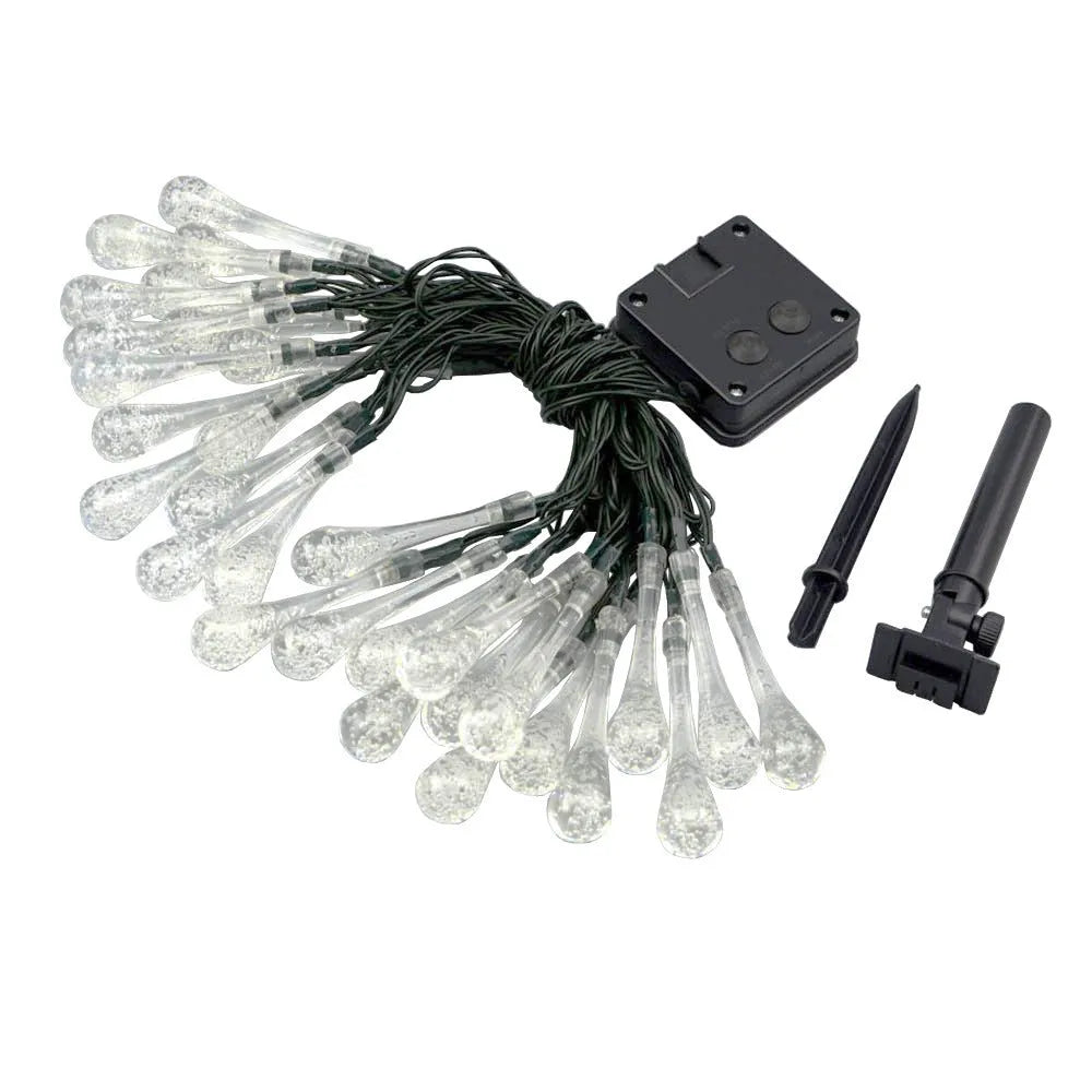 6.5 metre long solar-powered outdoor LED string lights with bubble drop pendants on a garden fence