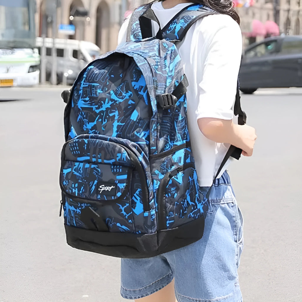 Classic blue nylon backpack with large main compartment shown on a plain background.