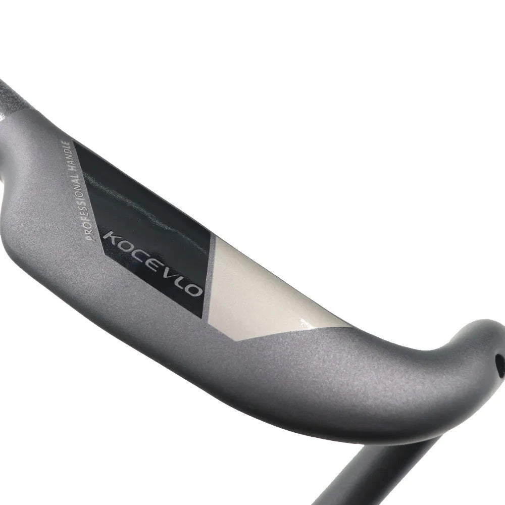 Wei Bike matt carbon fibre road bicycle drop handlebar shown from the side.