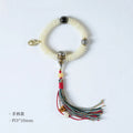 A white Bodhi seed bracelet shown in both a looped wrist style and a straight handheld style.