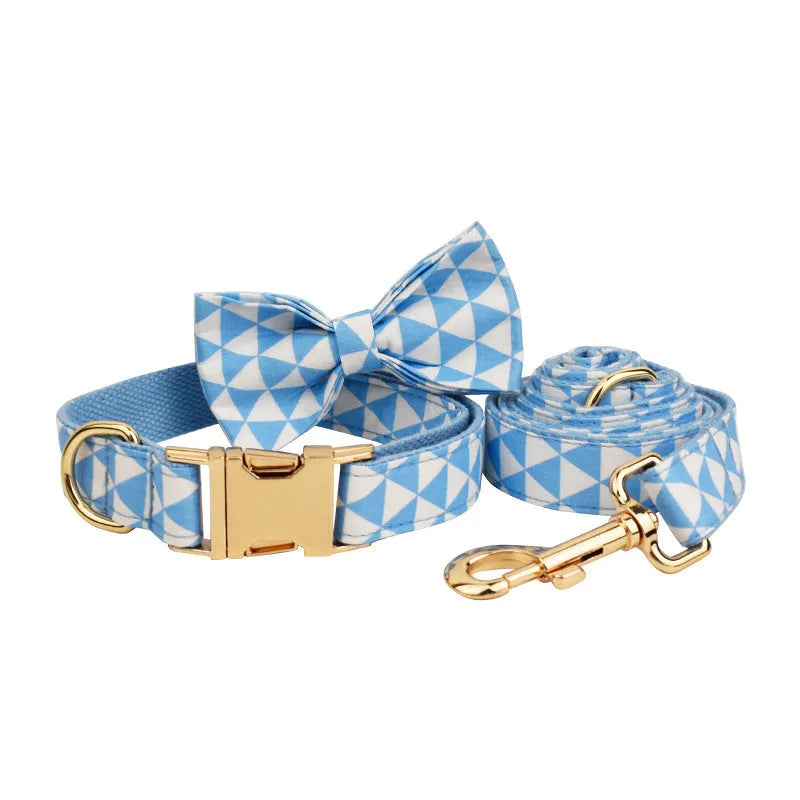 Blue cloth dog collar, leash, vest, and bow set with triangular ring rope design on a white background.
