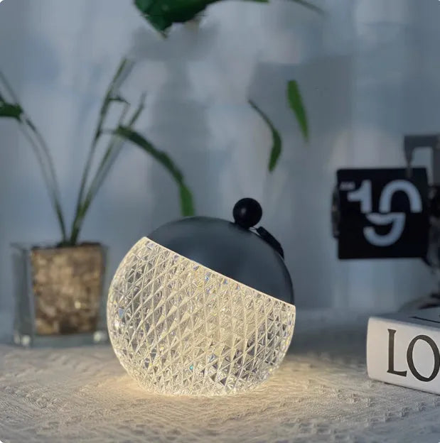 Modern cylindrical dimmable night lamp with touch control in a choice of five colours.