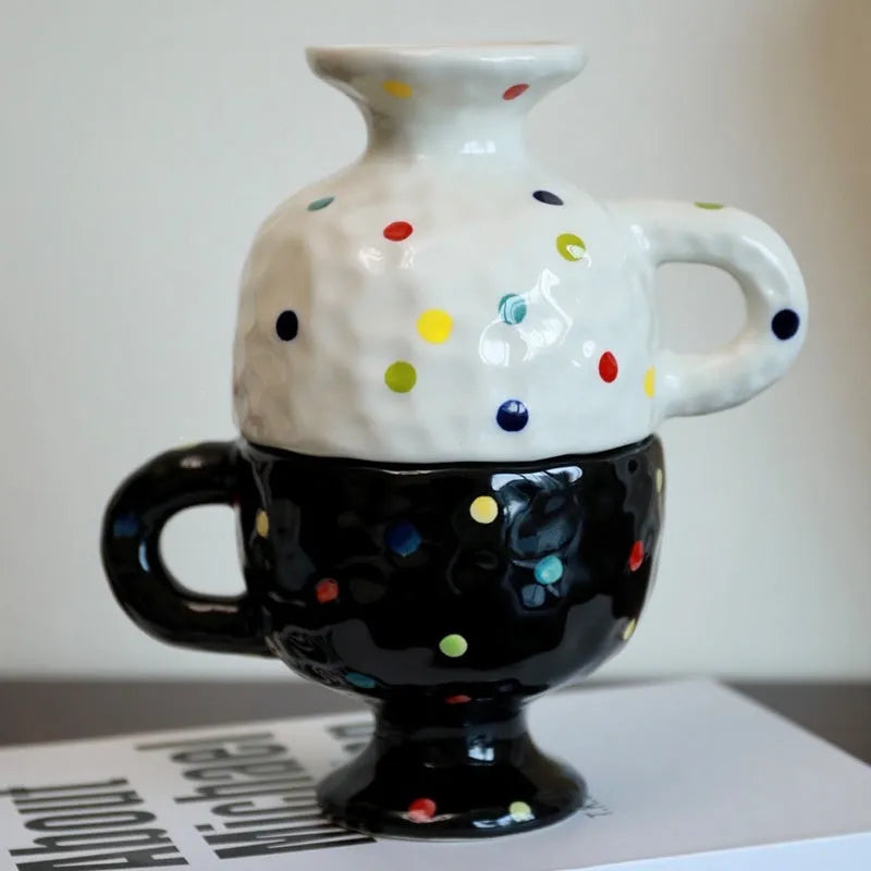 Hand-pinched irregular ceramic mug in solid colour with modern simple design