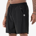 Man wearing black Ice Silk nylon sports shorts with a drawstring waist and cropped leg.