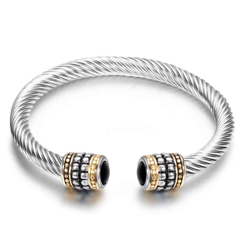 Two-tone vintage gold stainless steel bangle bracelet in black and golden finish