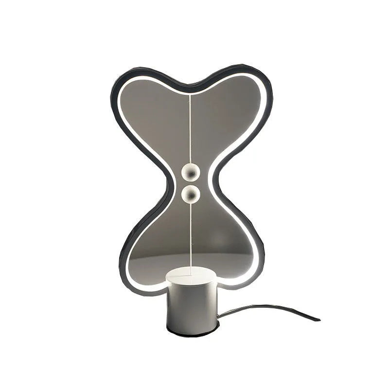 LED balance night lamp with 7 colour options, USB powered, showing suspended netball design