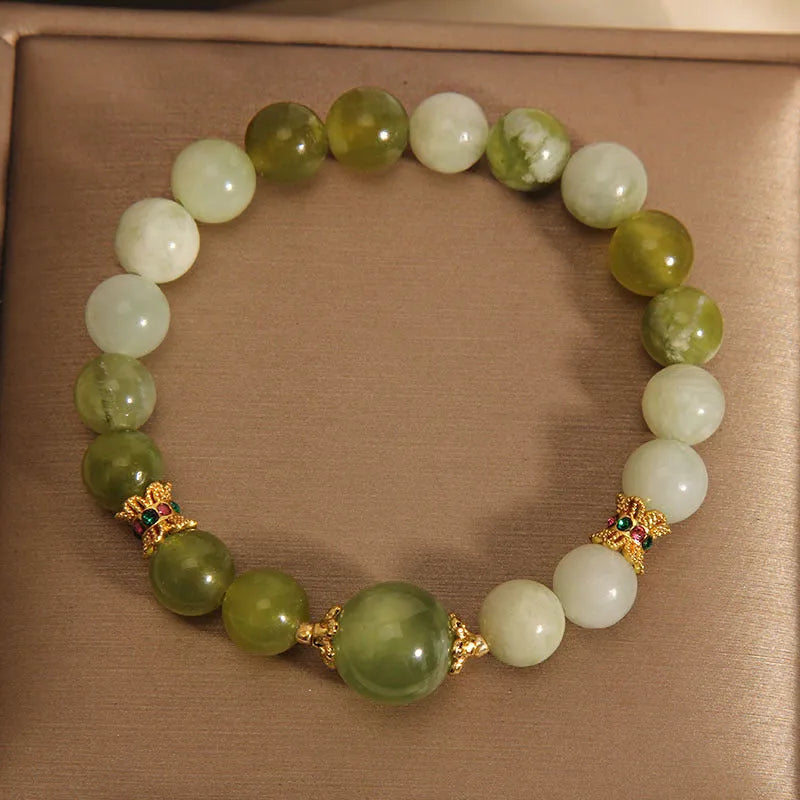 Women's bracelet made of green Xiuyan jade in an original sweet Mori style design.