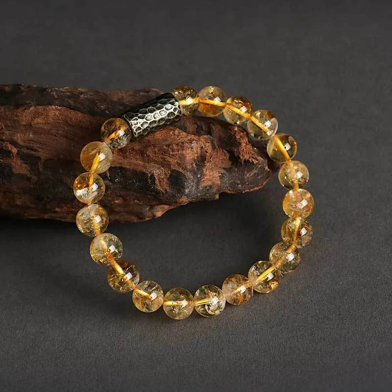 Handcrafted Barbie tan yellow tower crystal double ring bracelet on wrist.