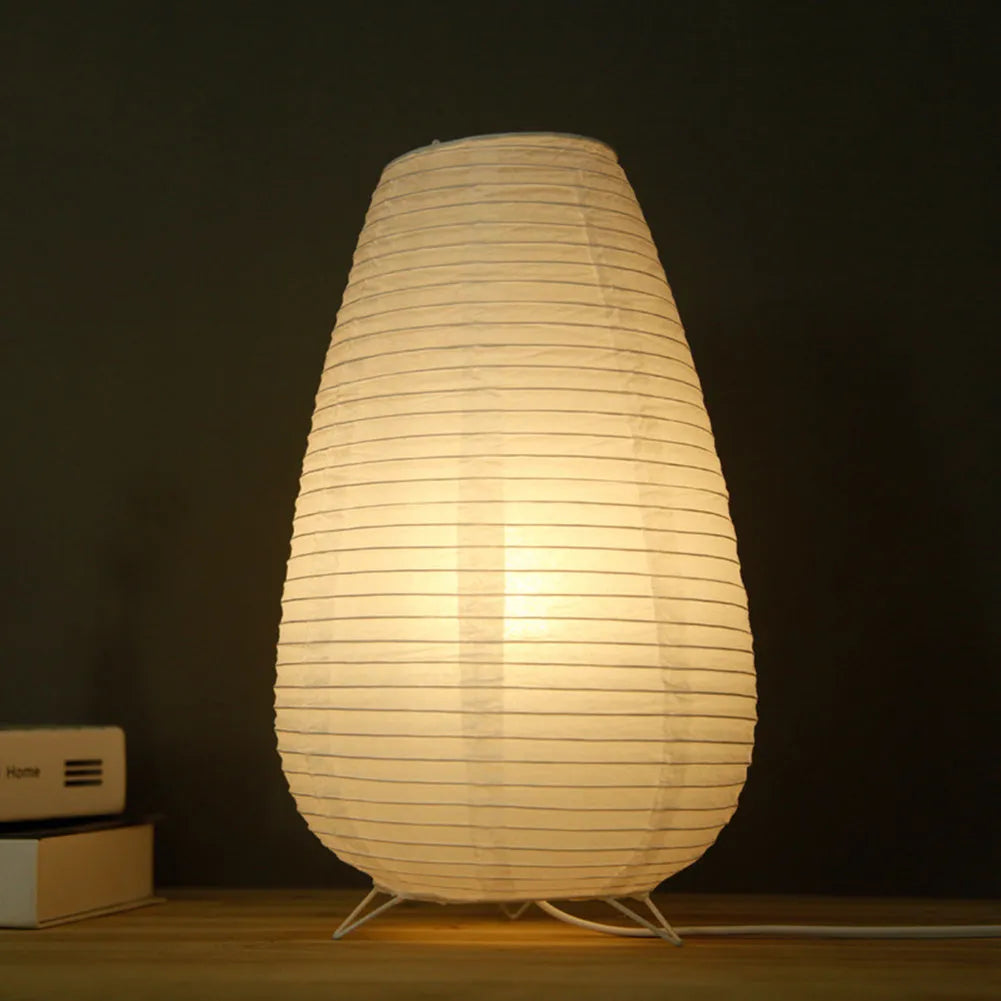 White traditional rice paper table lamp with E14 bulb holder on wooden desk