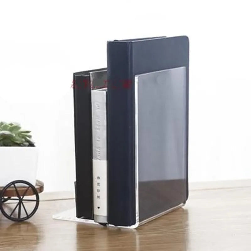Transparent acrylic bookshelf displaying books on desk with smooth polished edges