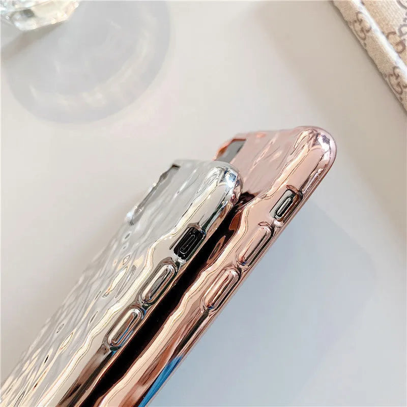 Foldable electroplated TPU iPhone case in rose gold and silver colours, shown on an iPhone.