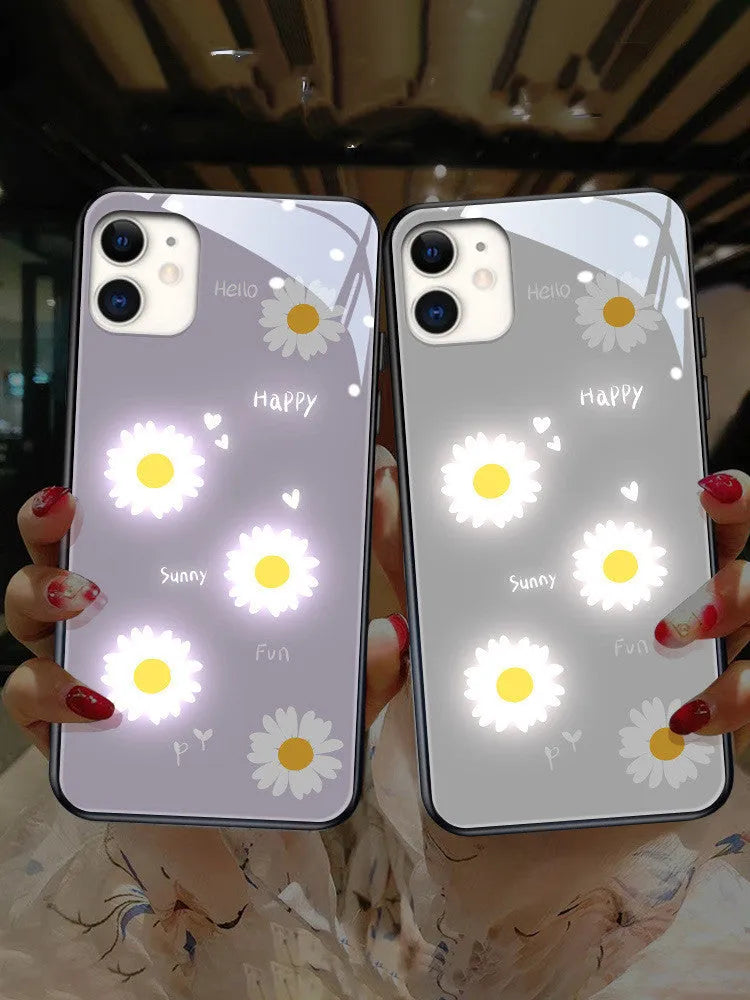 White iPhone case with painted purple daisies and voice-activated colour lights on the back.