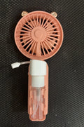 Coloured plastic USB rechargeable personal fan on a desk