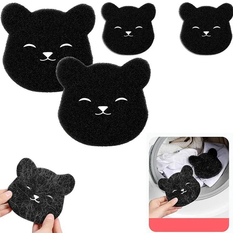 Two black bear-shaped sponge cleaning balls for pet hair removal in laundry