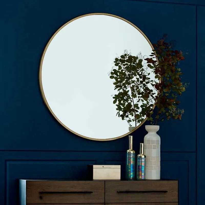 Round iron-framed bathroom wall mirror in black, gold, or white finish