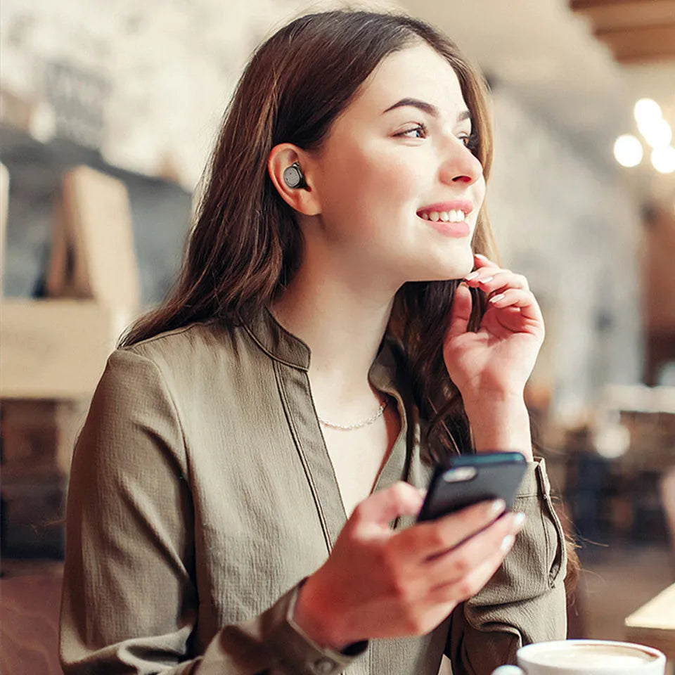 Wireless Bluetooth stereo earbud headset showing four colour options: black, white, red, and blue