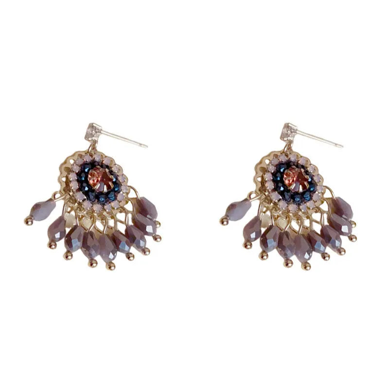 Round crystal tassel earrings with diamond embedded design and thick gold plating in blue or purple colour options