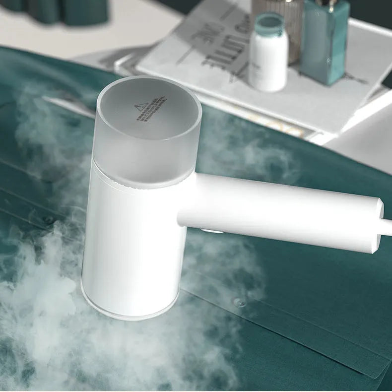 White hand-held hanging garment steamer with separate water tank and stainless steel panel