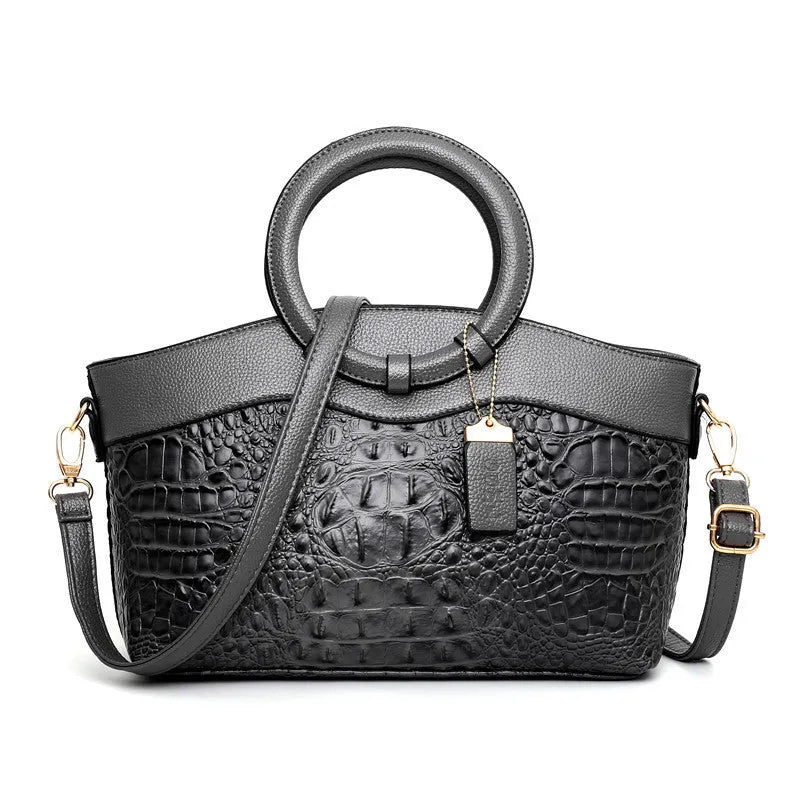 Fabric casual ladies shoulder bag in multiple colours showing zipper compartments and dimensions 31x21x13cm.