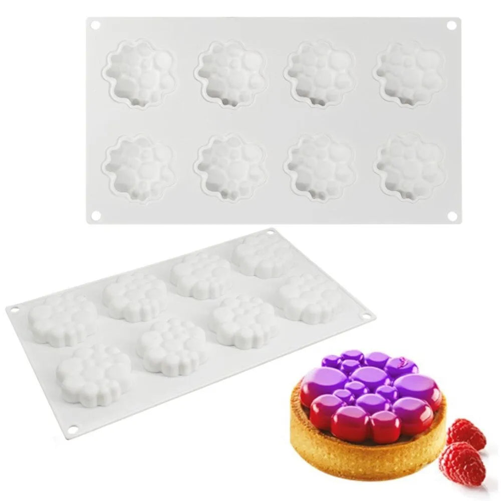 Round silicone baking mould with 8-bubble patterned base for cakes and desserts.