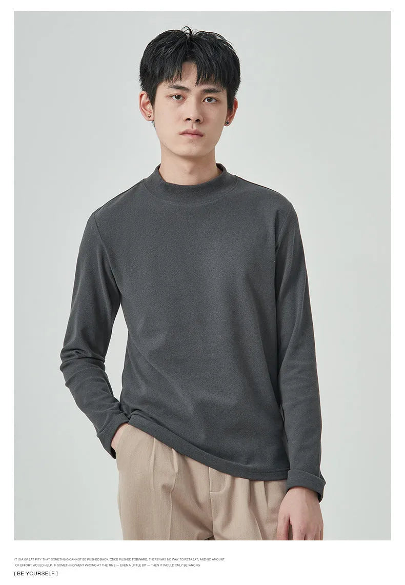 Men's solid colour half-high collar long sleeve t-shirt in Dralon fabric on a hanger.