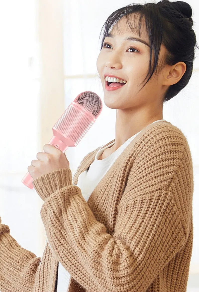 Wireless Bluetooth karaoke microphone in pink, blue, or green colours with USB charging port