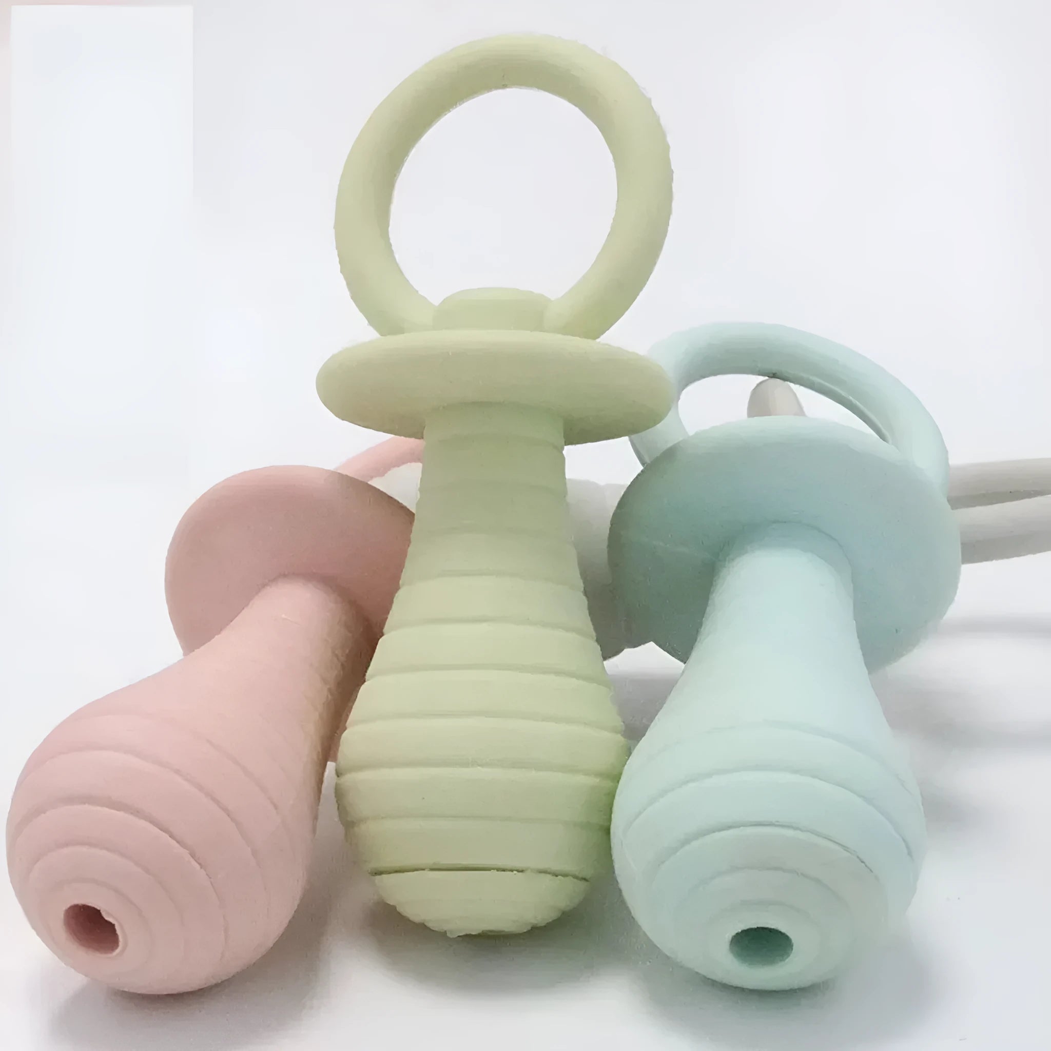 Soft TPR pacifier chew toy for puppies and kittens in blue, with internal squeaker.