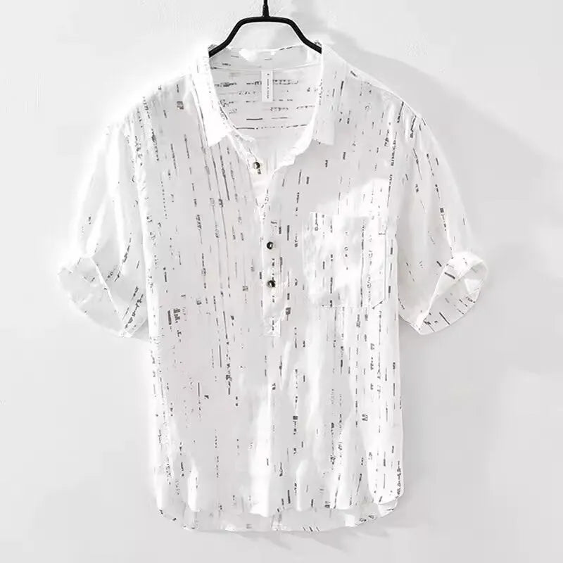 Man wearing a black loose-fit lapel polo shirt, short sleeves, casual summer style.